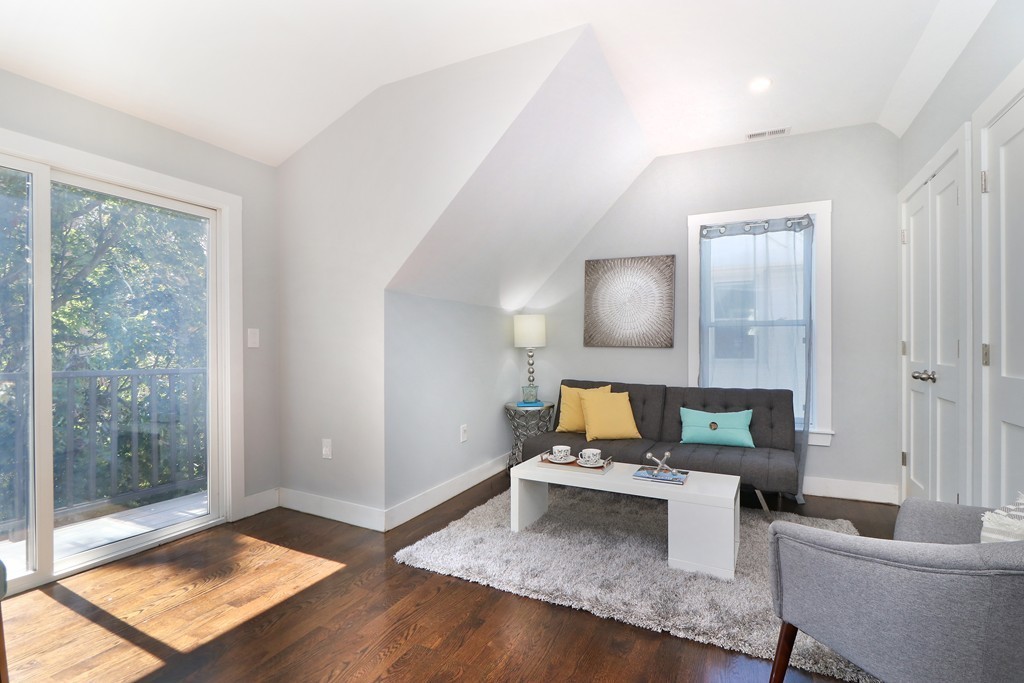 59 Mozart Street, Unit 2 Boston, MA 02130 - Photo 10 of 21 a living room with furniture and a window