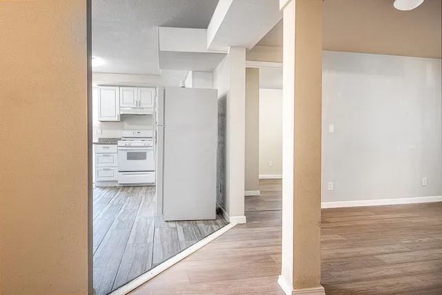 a view of walk in closet with empty racks