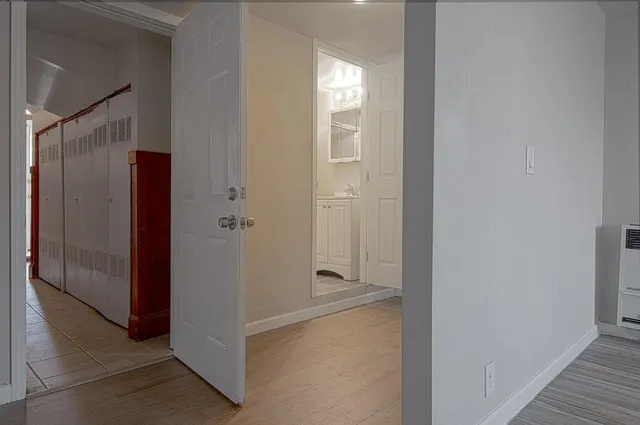 a view of a bathroom from the hallway