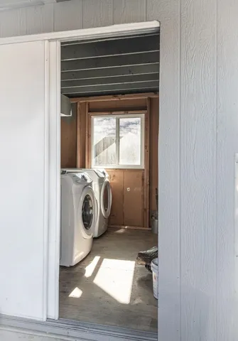 a utility room with dryer and washer