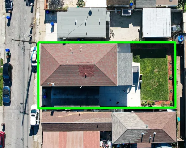 an aerial view of a tennis ground with large trees
