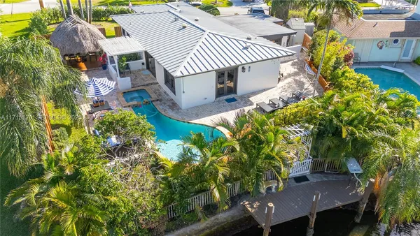a view of a yard with plants and outdoor seating