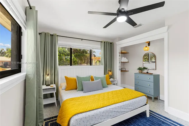 a view of a chair and tables in the patio