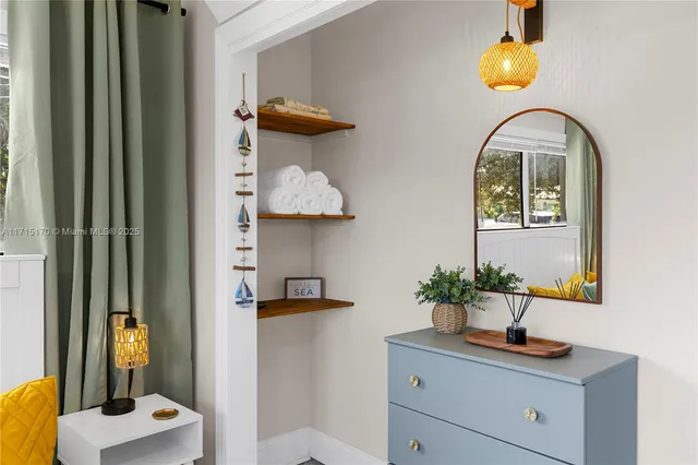 a view of a patio with table and chairs potted plants with wooden floor