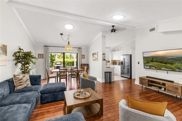 a kitchen with a sink appliances and cabinets