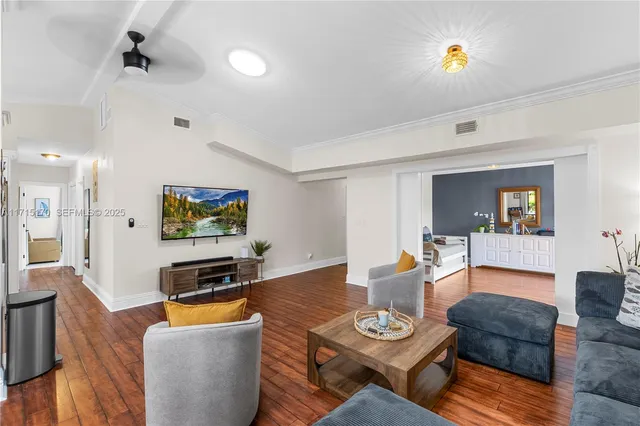 a view of a patio with a table chairs and a yard