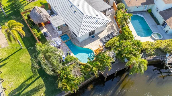 a view of a yard with potted plants