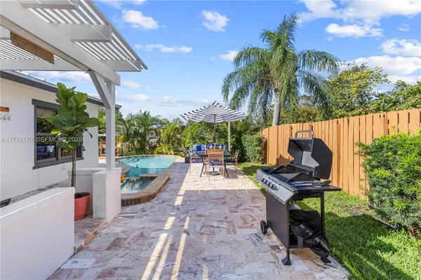 a view of a chairs and table in the patio