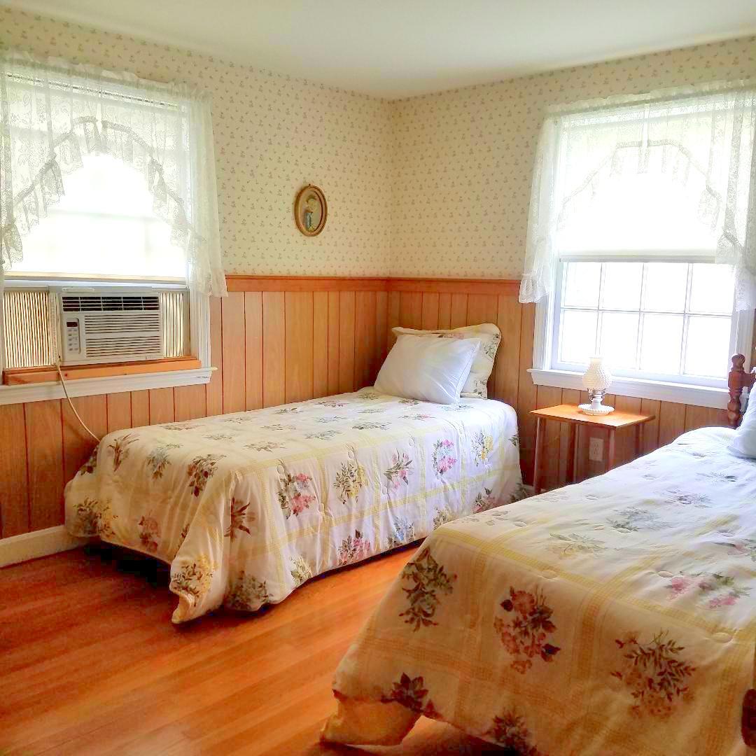 15 Osborne Road Harwich, MA 02671 - Photo 15 of 32 a bedroom with a bed and a large window