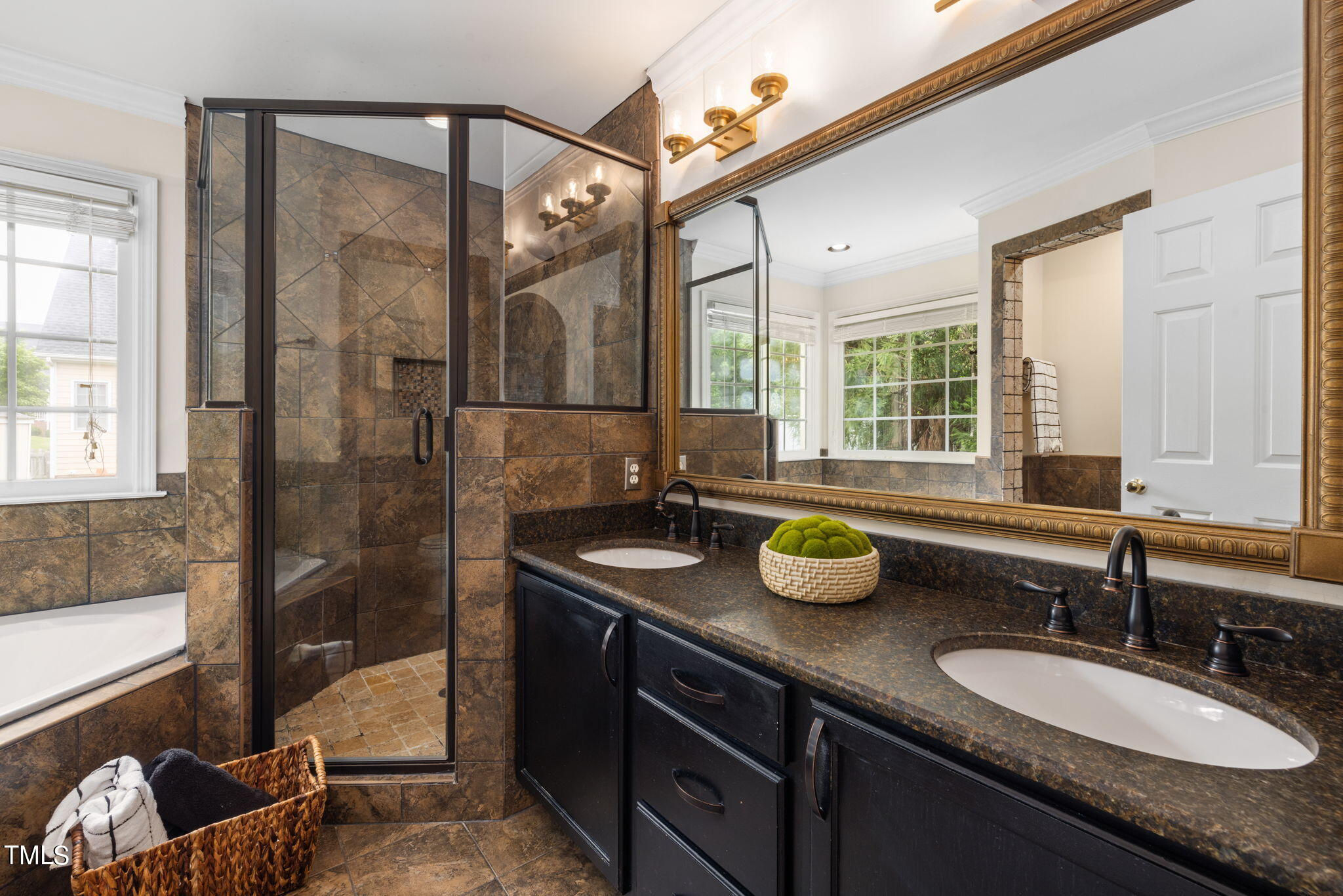 8673 Harps Mill Road Raleigh, NC 27615 - Photo 21 of 38 a bathroom with a granite countertop sink and a mirror