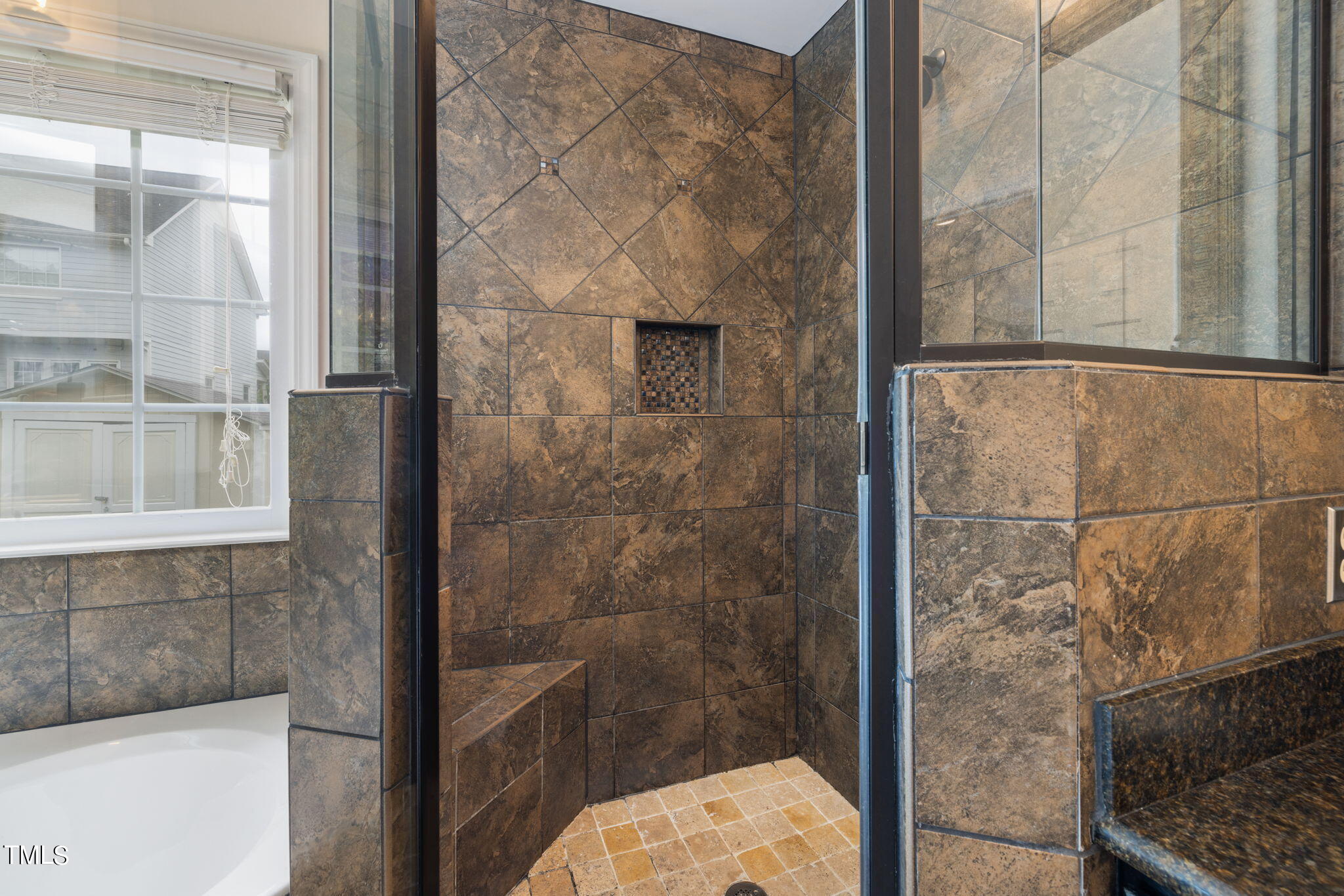 8673 Harps Mill Road Raleigh, NC 27615 - Photo 22 of 38 a bathroom with a shower