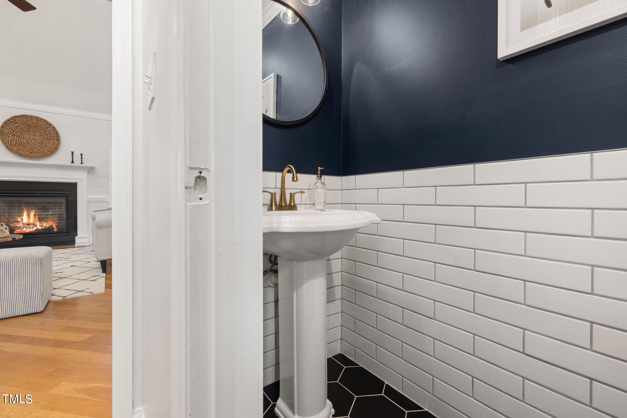 8673 Harps Mill Road Raleigh, NC 27615 - Photo 26 of 38 a bathroom with a sink and a mirror