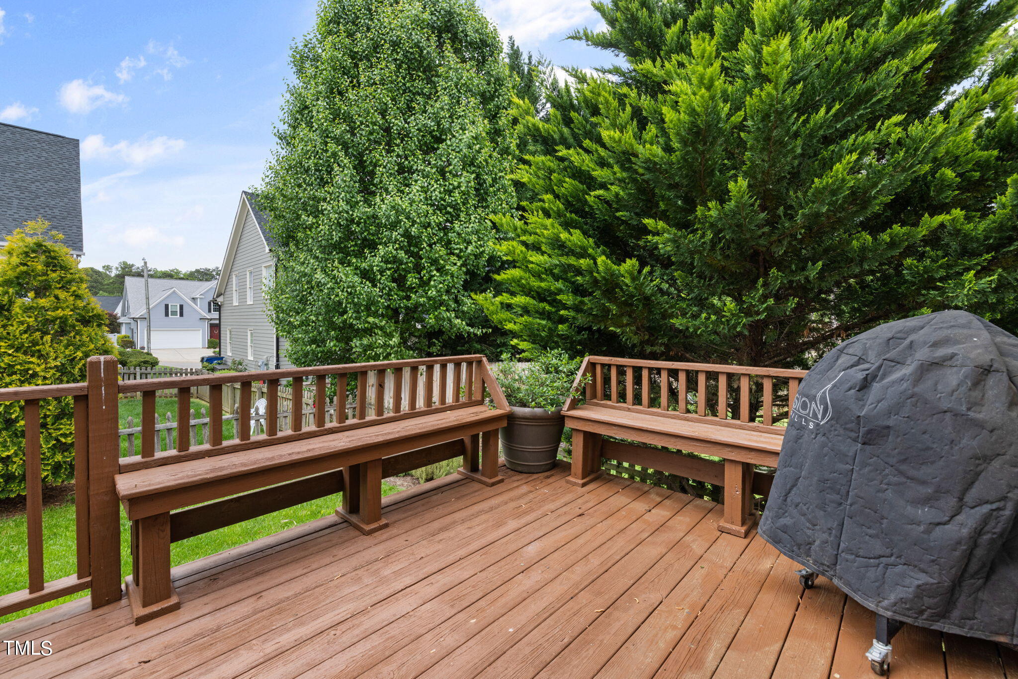 8673 Harps Mill Road Raleigh, NC 27615 - Photo 33 of 38 a view of a wooden deck with furniture