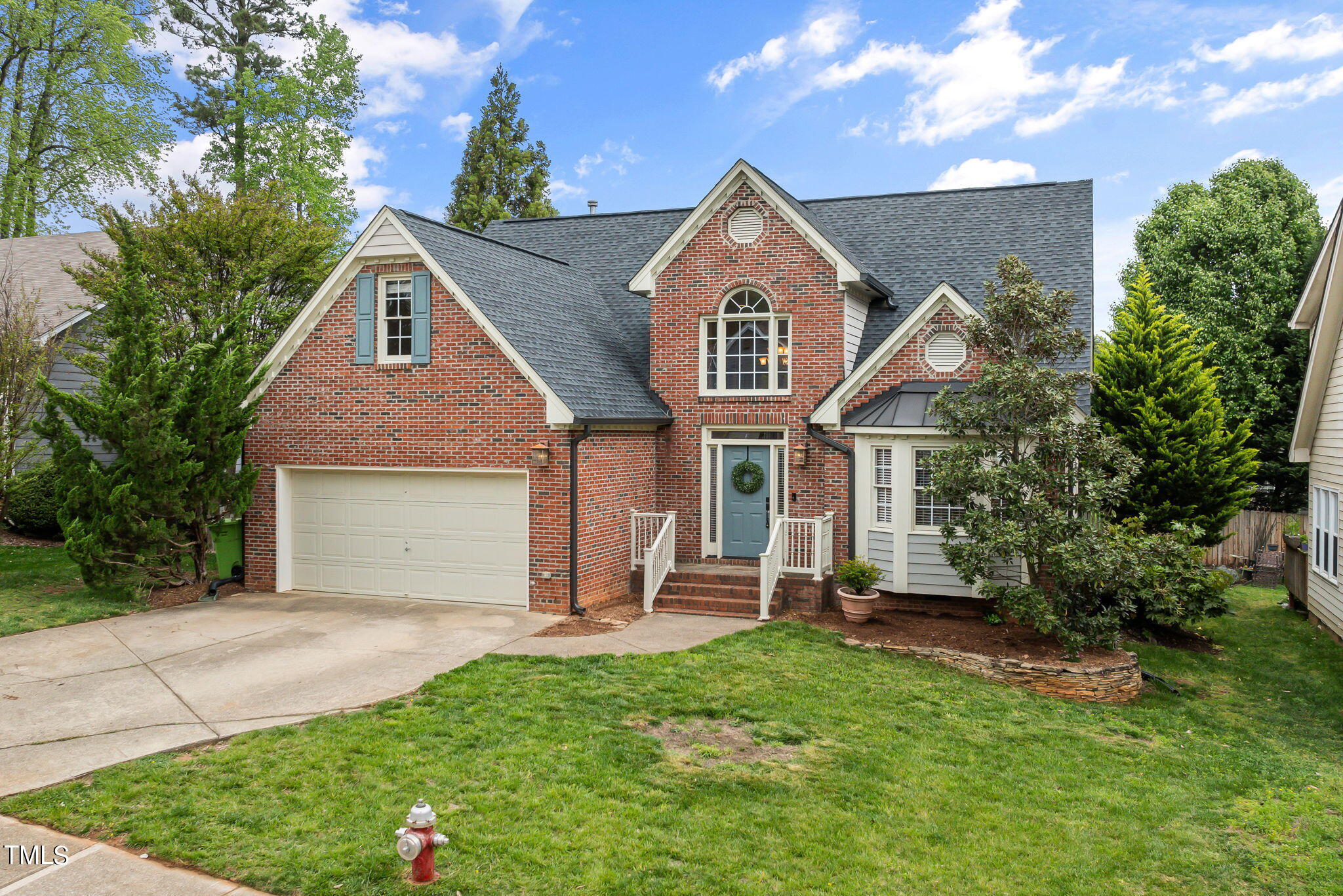 8673 Harps Mill Road Raleigh, NC 27615 - Photo 38 of 38 a front view of a house with a yard