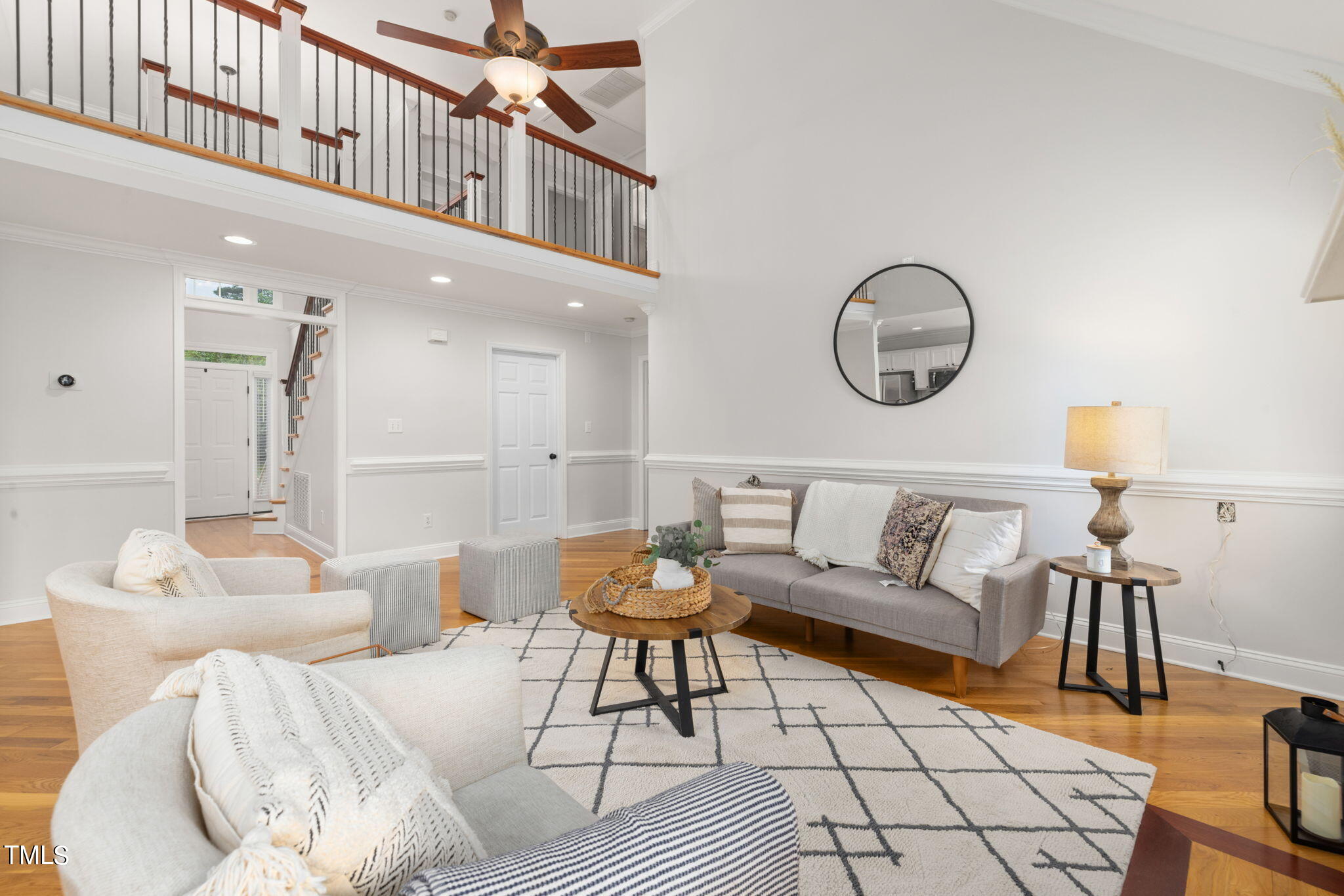 8673 Harps Mill Road Raleigh, NC 27615 - Photo 5 of 38 a living room with furniture and a rug