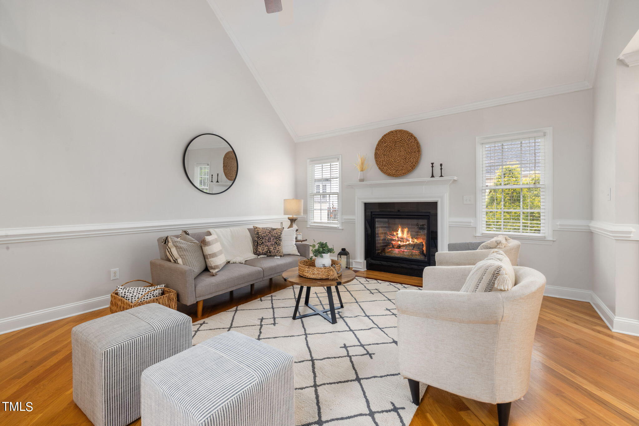 8673 Harps Mill Road Raleigh, NC 27615 - Photo 6 of 38 a living room with furniture a window and a fireplace