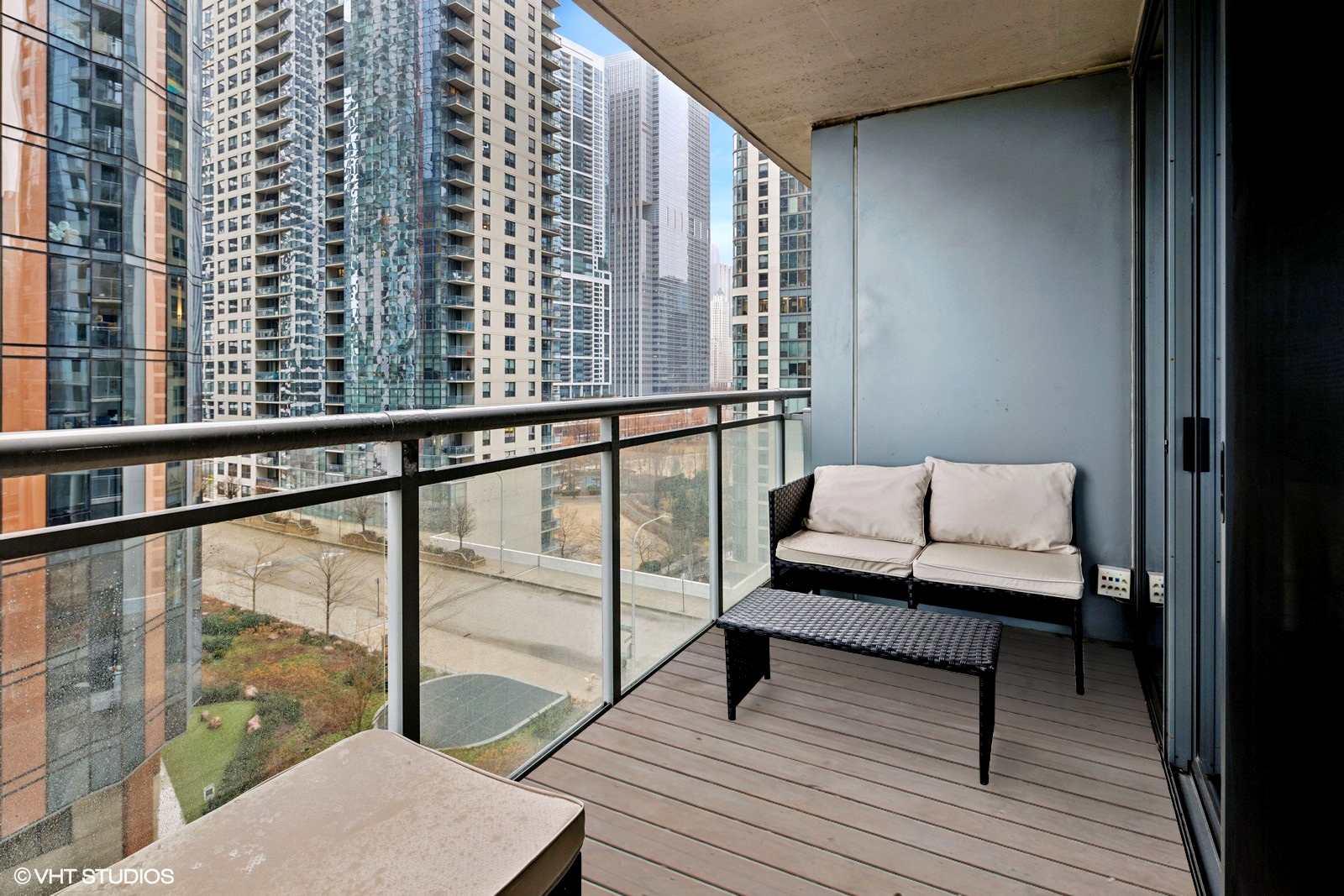 450 East Waterside Drive, Unit 505 Chicago, IL 60601 - Photo 13 of 32 a view of a balcony with wooden floor and furniture