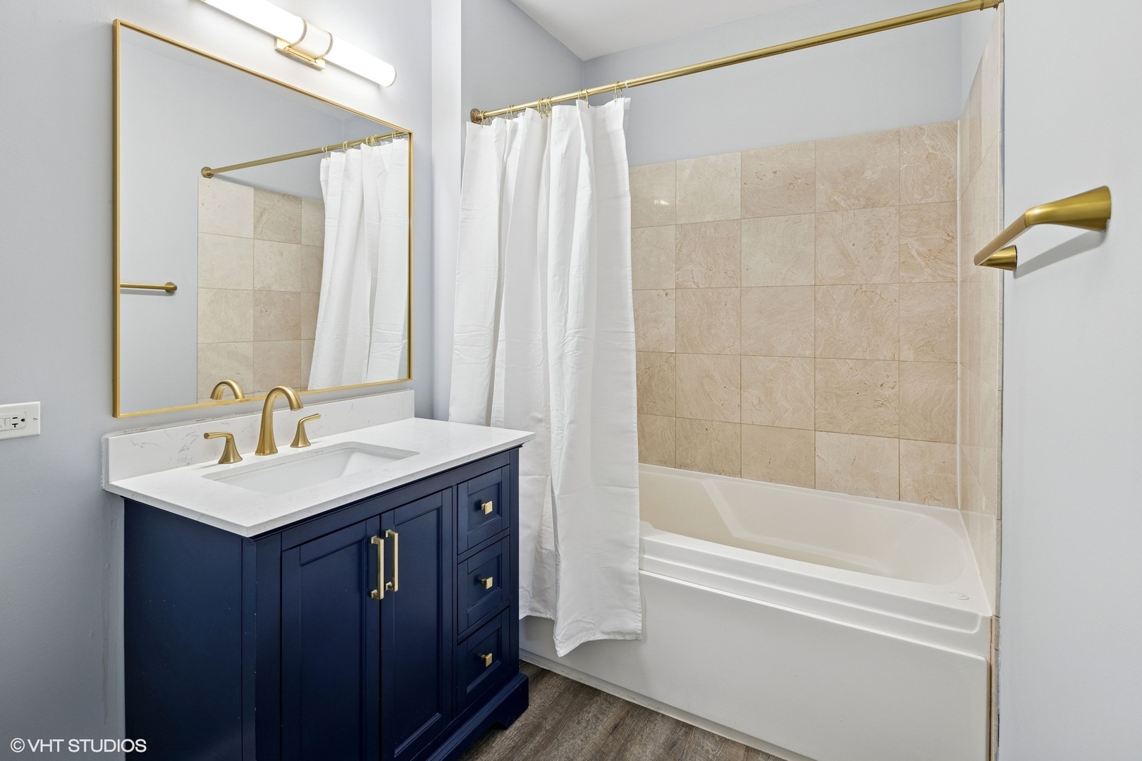 450 East Waterside Drive, Unit 505 Chicago, IL 60601 - Photo 16 of 32 a bathroom with a bath tub sink mirror and a shower