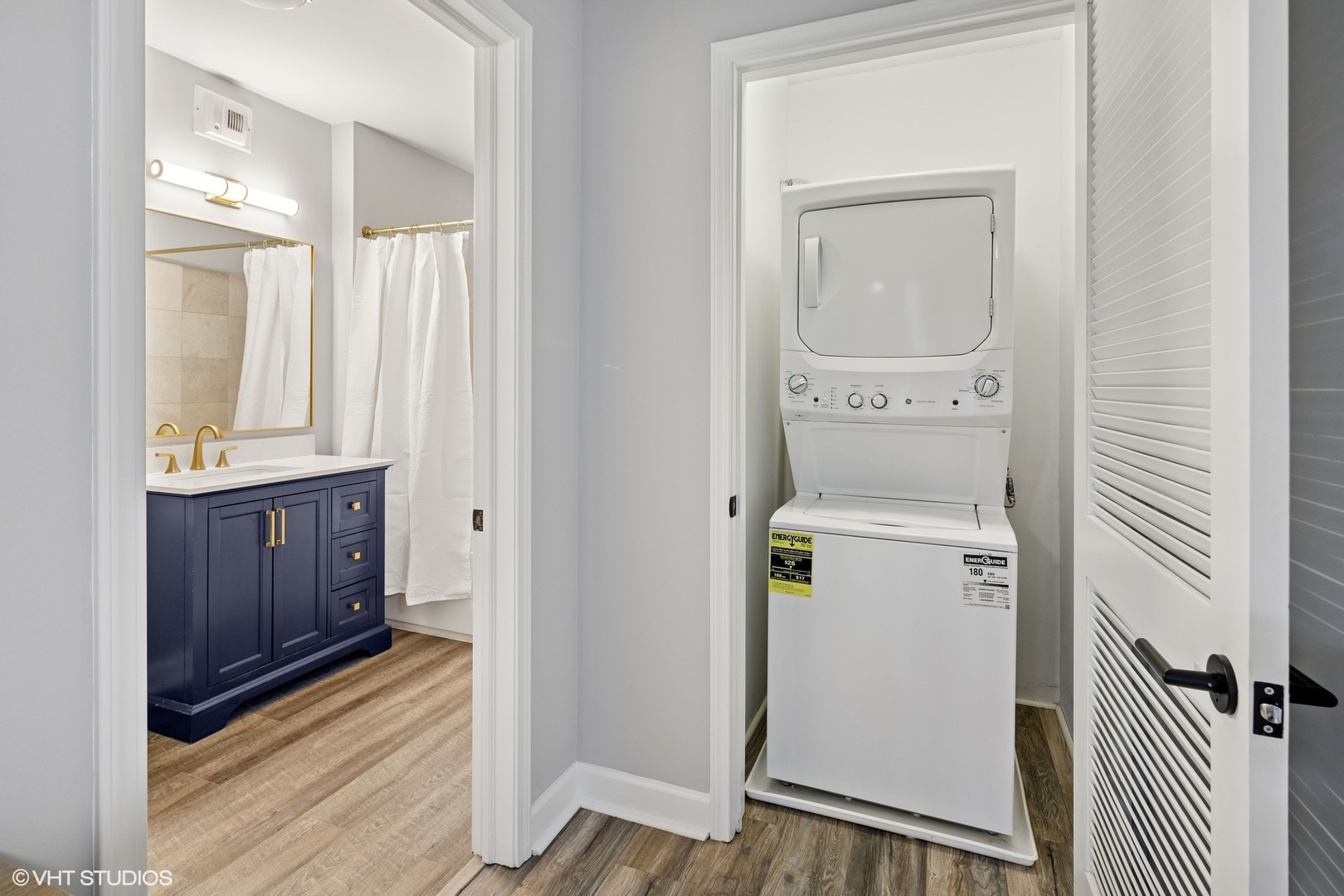 450 East Waterside Drive, Unit 505 Chicago, IL 60601 - Photo 17 of 32 a view of a hallway with washer and dryer