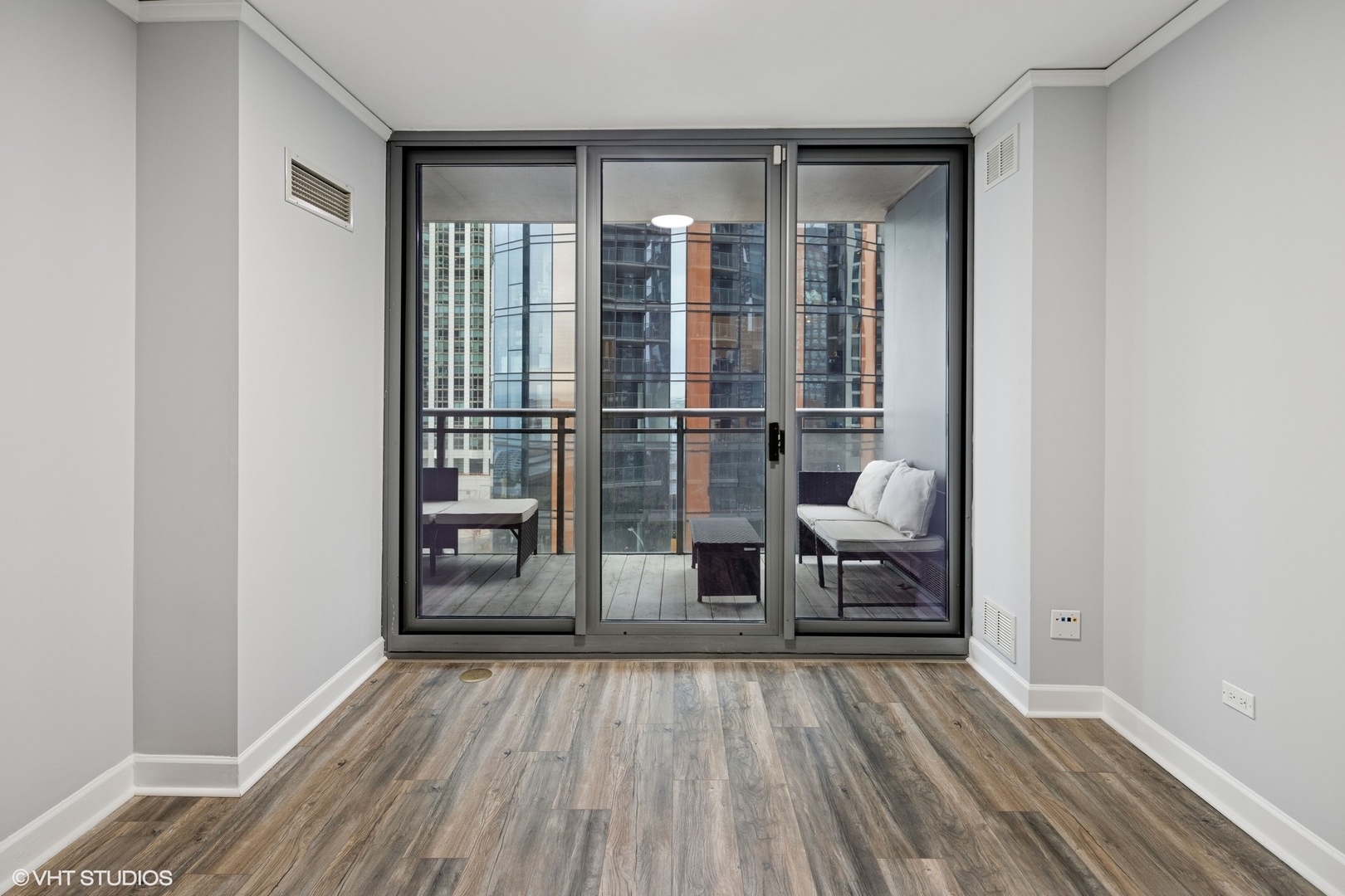 450 East Waterside Drive, Unit 505 Chicago, IL 60601 - Photo 18 of 32 a view of empty room with wooden floor