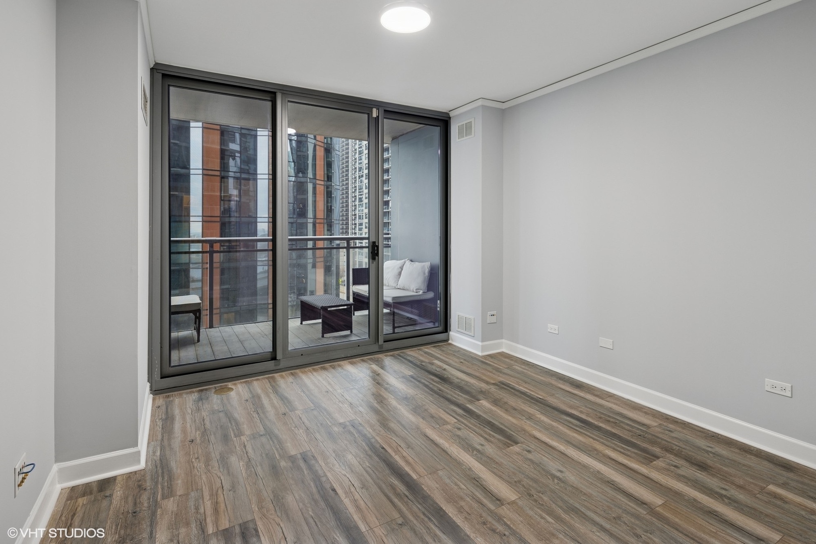 450 East Waterside Drive, Unit 505 Chicago, IL 60601 - Photo 19 of 32 a view of empty room with wooden floor