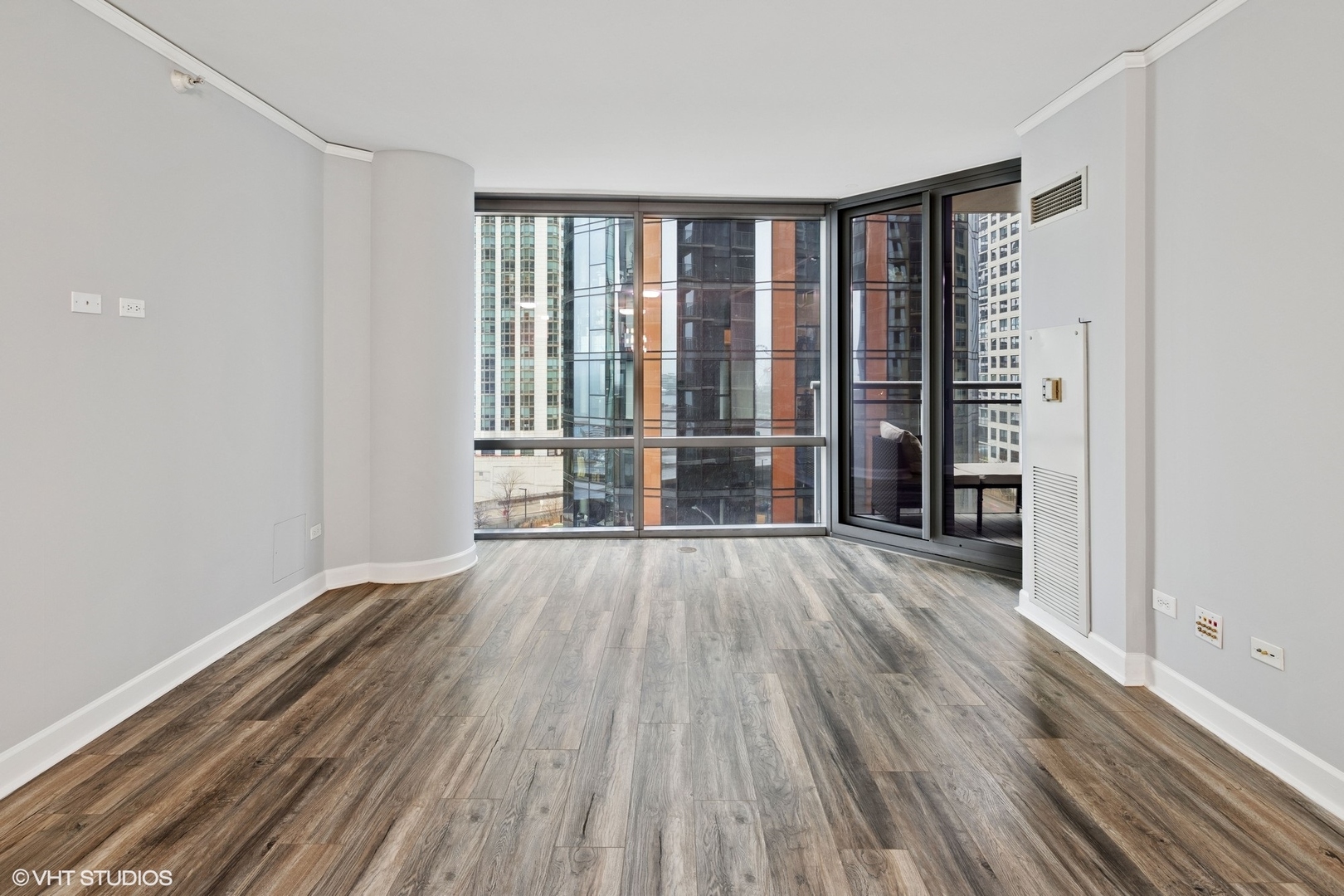 450 East Waterside Drive, Unit 505 Chicago, IL 60601 - Photo 2 of 32 wooden floor in an empty room with a window