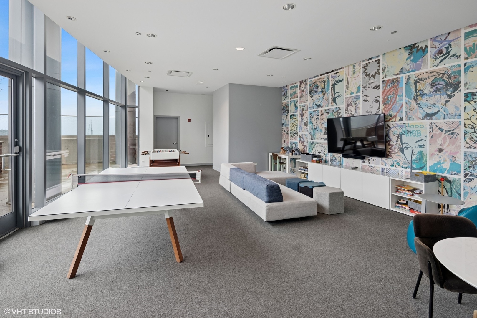 450 East Waterside Drive, Unit 505 Chicago, IL 60601 - Photo 27 of 32 a living room with furniture and a flat screen tv