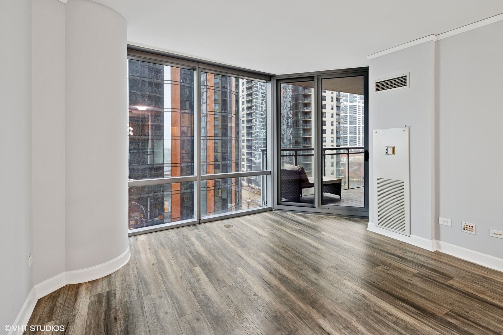 450 East Waterside Drive, Unit 505 Chicago, IL 60601 - Photo 4 of 32 a view of a room with wooden floor and a window