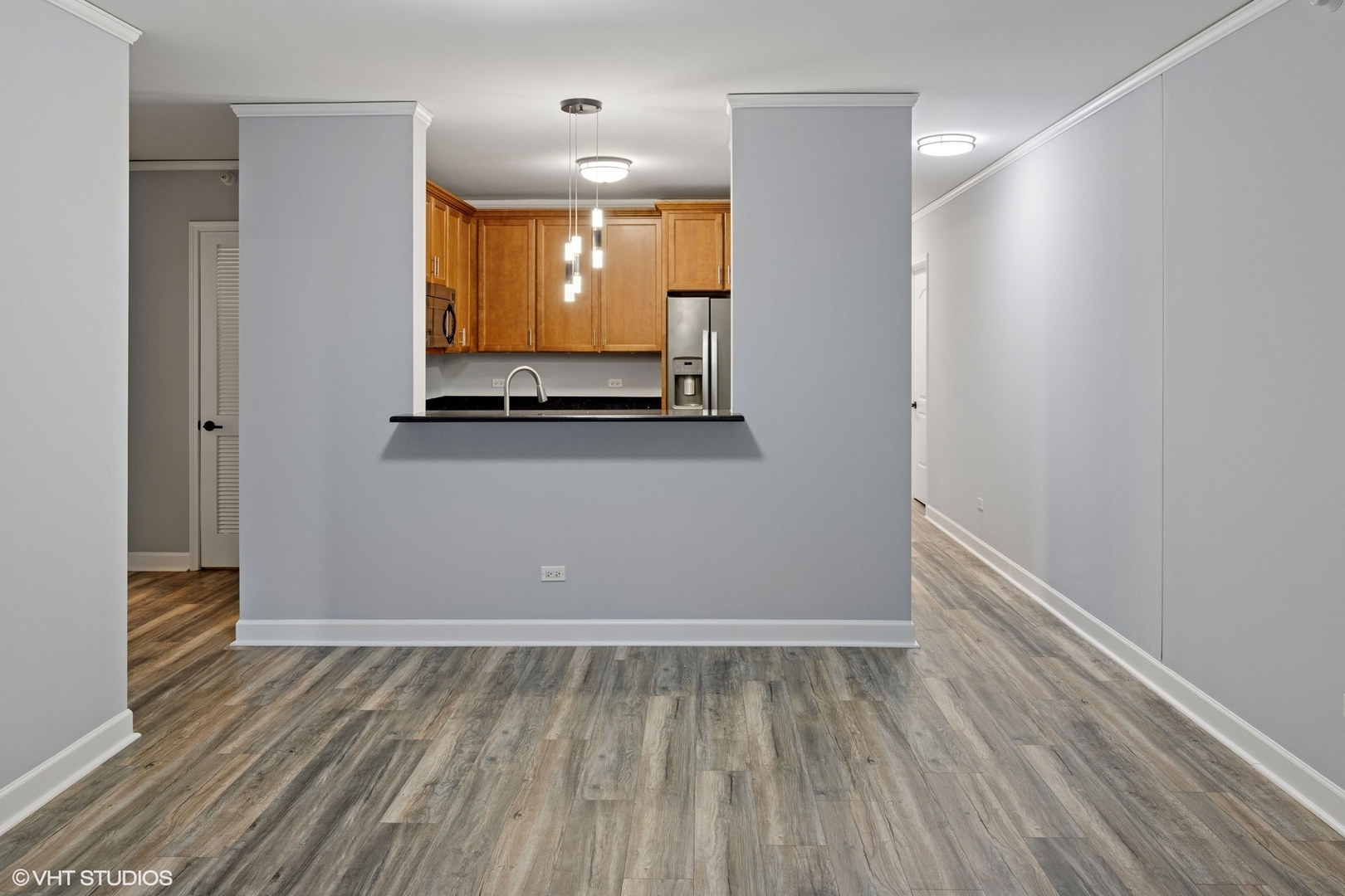 450 East Waterside Drive, Unit 505 Chicago, IL 60601 - Photo 7 of 32 a view of room with window and wooden floor