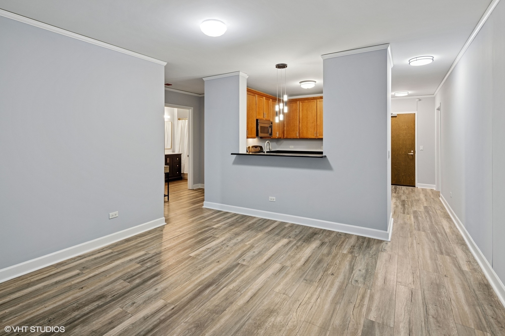 450 East Waterside Drive, Unit 505 Chicago, IL 60601 - Photo 8 of 32 wooden floor in an empty room with a window