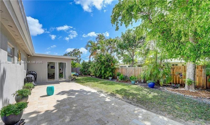 1180 Southwest 4th Terrace Pompano Beach, FL 33060 - Photo 7 of 8 a view of a house with yard and tree s