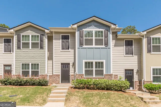 a front view of a house with a yard