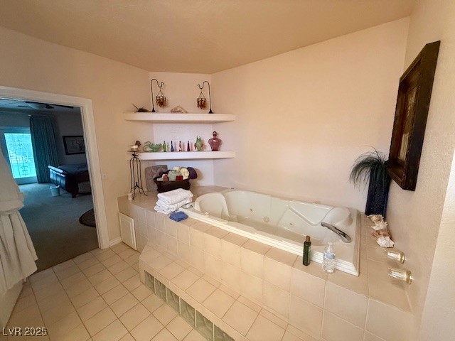 10561 Rancho Destino Road Las Vegas, NV 89183 - Photo 18 of 29 Bathroom featuring tile patterned floors and a tub with jets