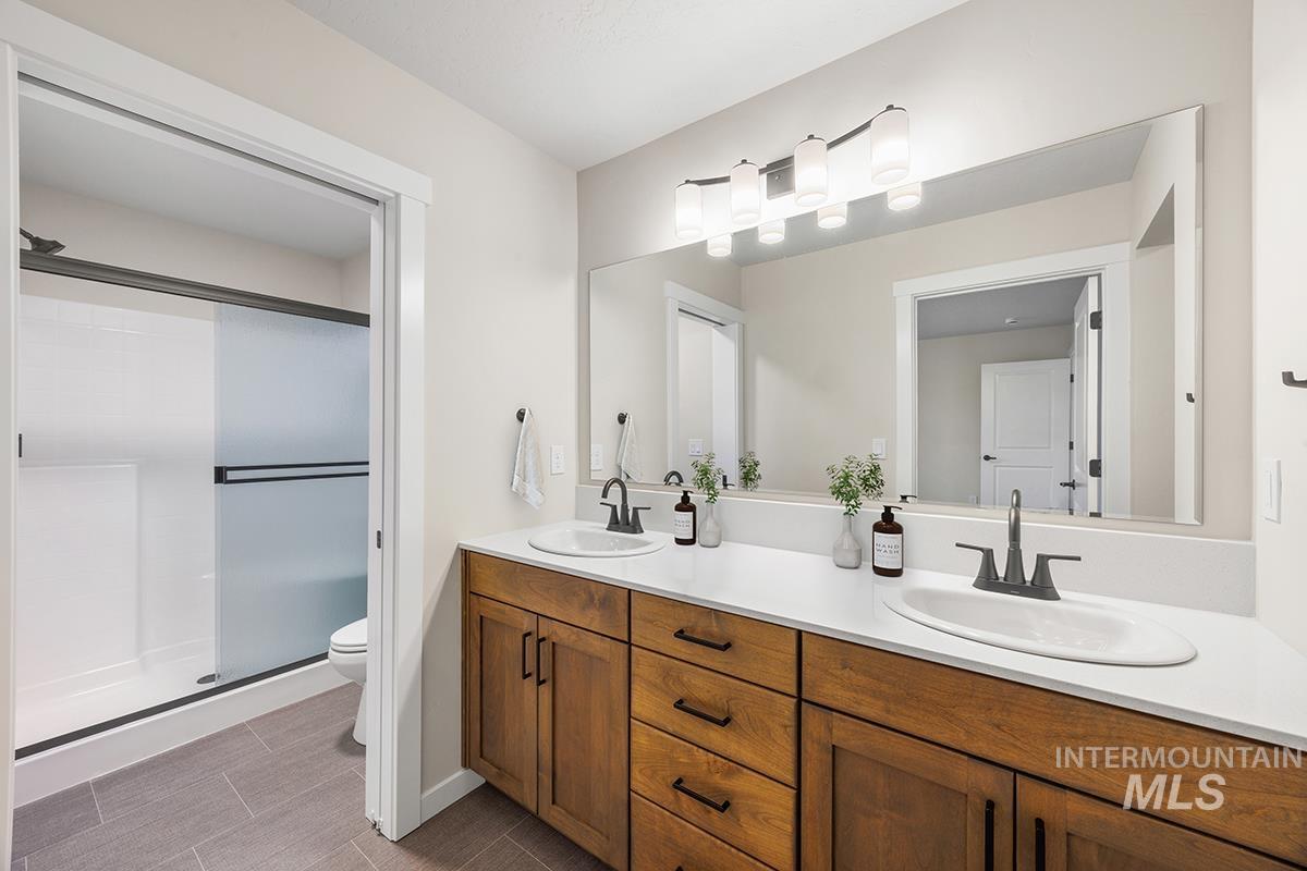 212 West Broyhill Street Meridian, ID 83642 - Photo 9 of 22 Full bathroom with double vanity and a stall shower
