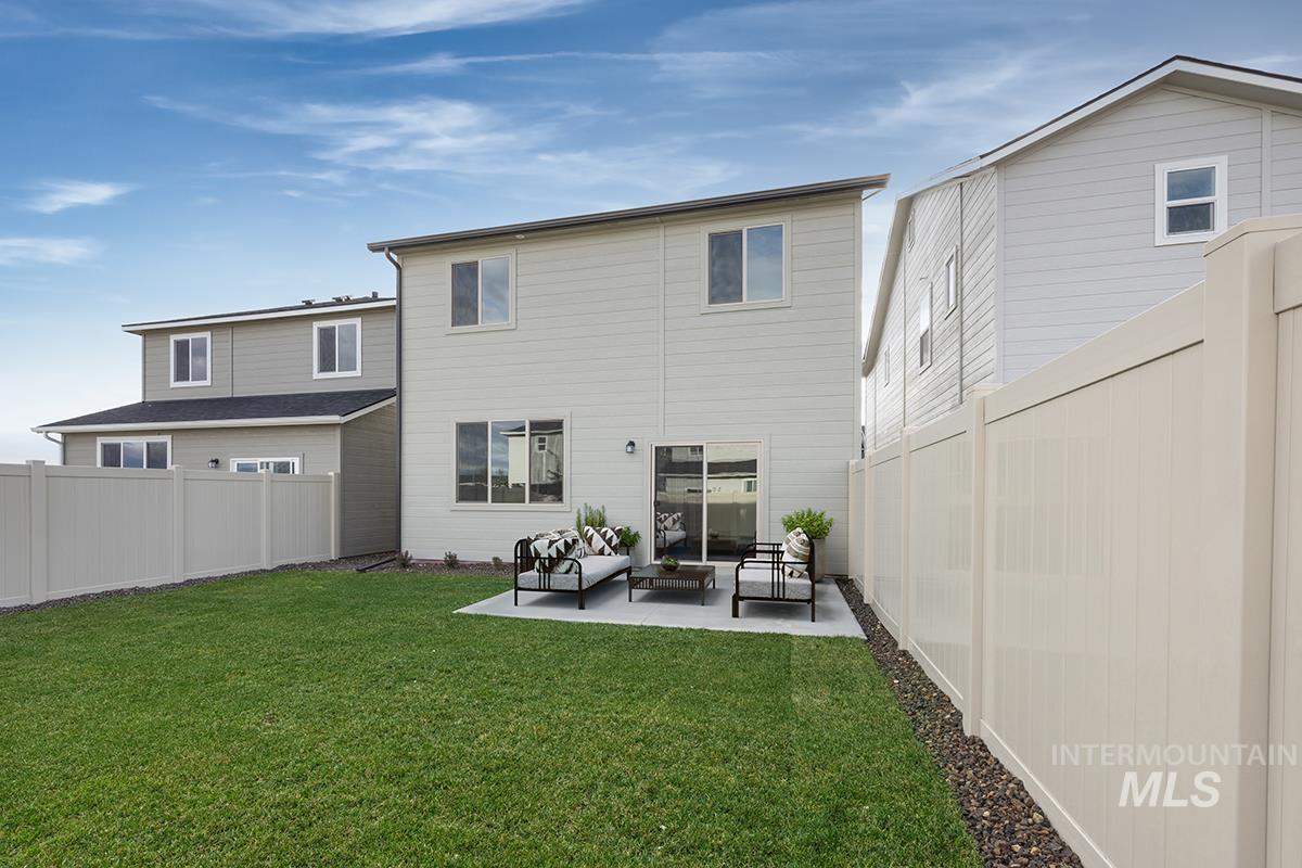 212 West Broyhill Street Meridian, ID 83642 - Photo 12 of 22 Rear view of house with a fenced backyard, a patio, and an outdoor hangout area