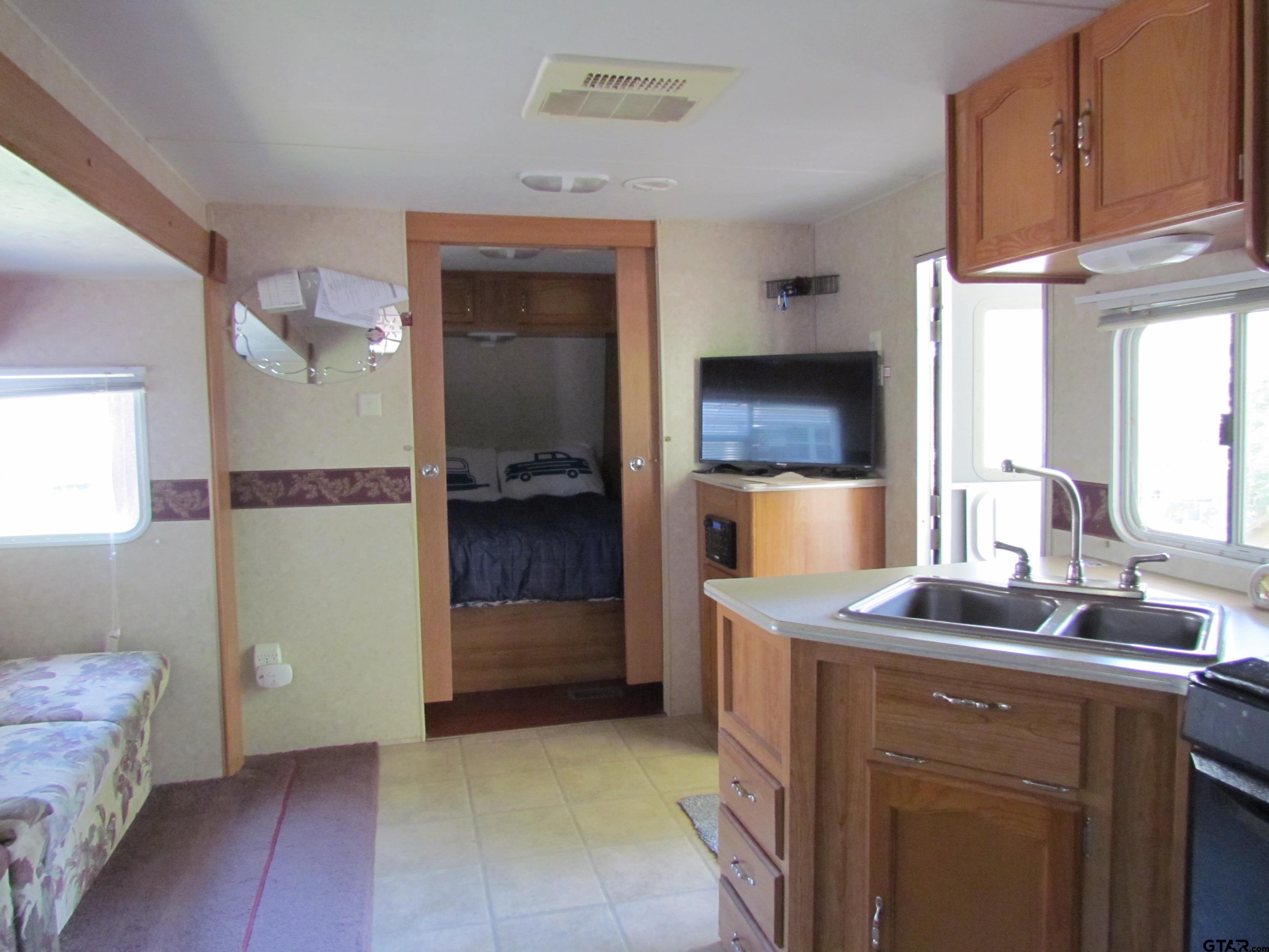 5800 Yantis Tx 75497 Yantis, TX 75497 - Photo 12 of 16 a kitchen with a sink and cabinets