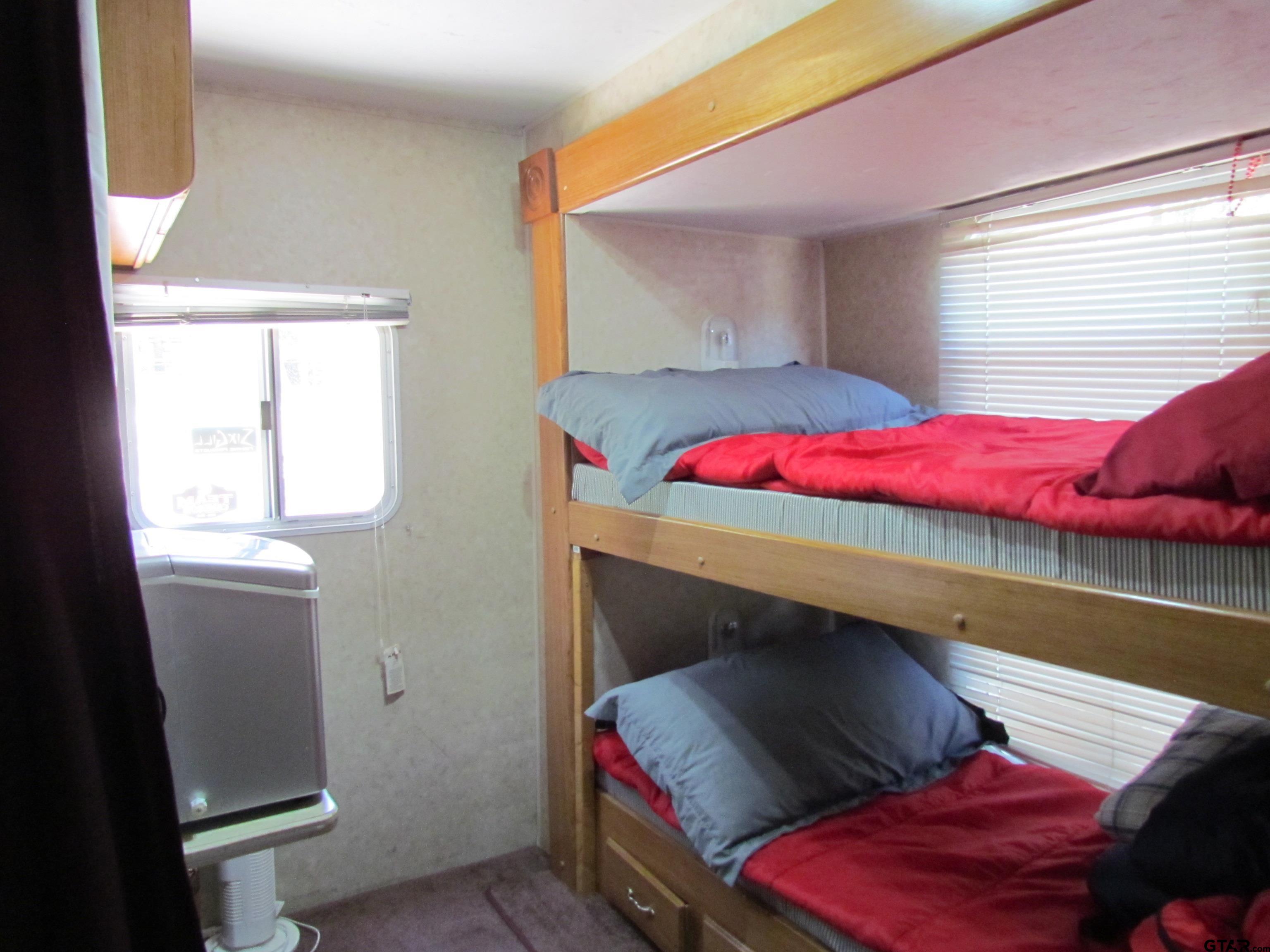 5800 Yantis Tx 75497 Yantis, TX 75497 - Photo 7 of 16 a bedroom with a bed and a window