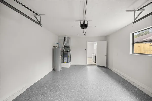 a view of a storage & utility room with windows
