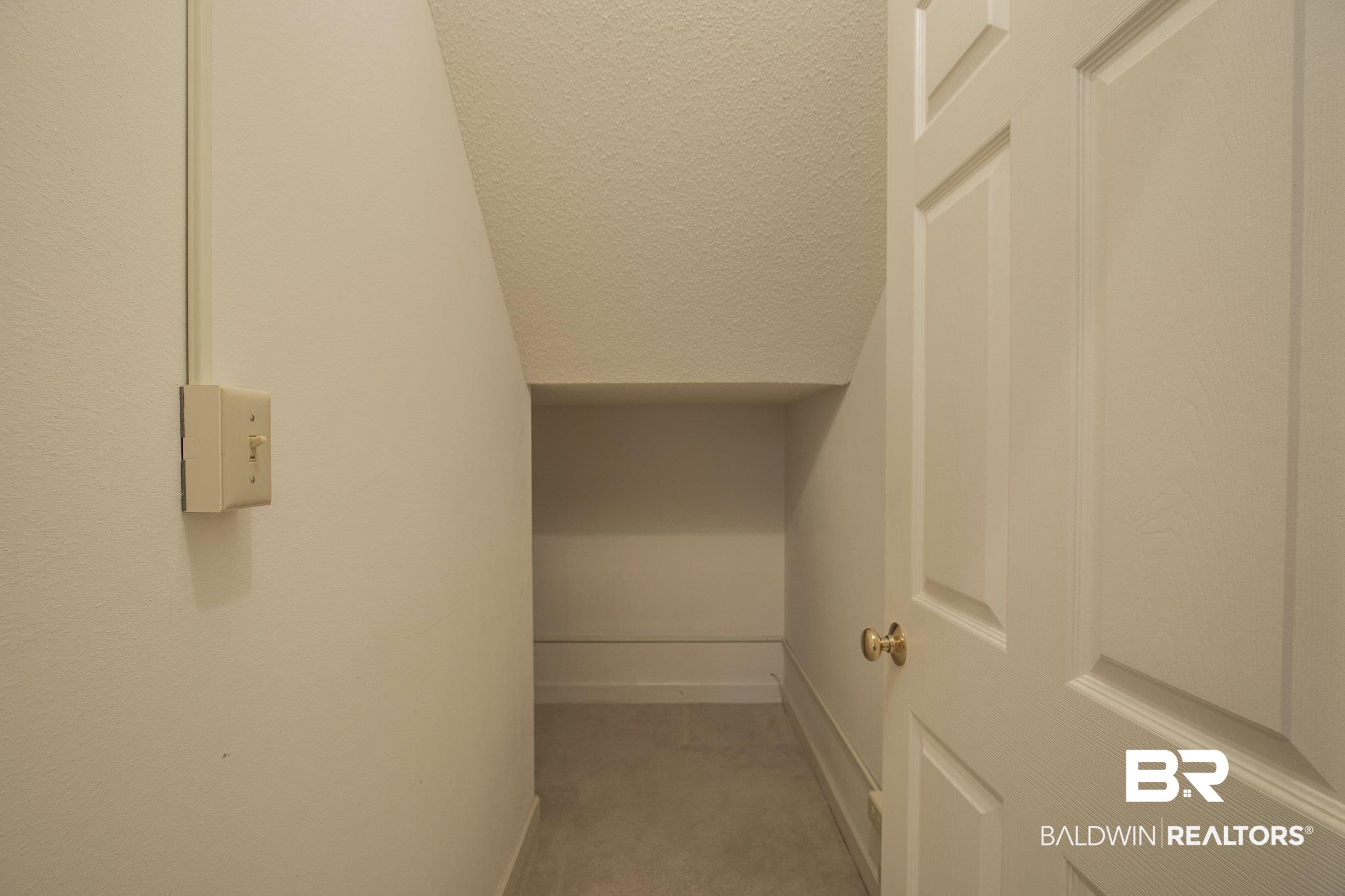 9404 Soldier Creek Road Lillian, AL 36549 - Photo 33 of 49 Storage Under Stairs
