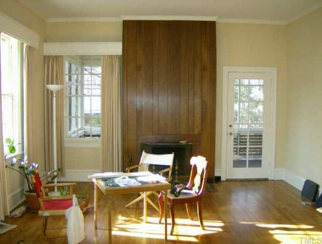 205 Forest Raleigh Nc 27605 Raleigh, NC 27605 - Photo 2 of 4 a workspace with furniture and window
