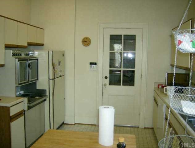 205 Forest Raleigh Nc 27605 Raleigh, NC 27605 - Photo 4 of 4 a bathroom with a granite countertop sink and a mirror