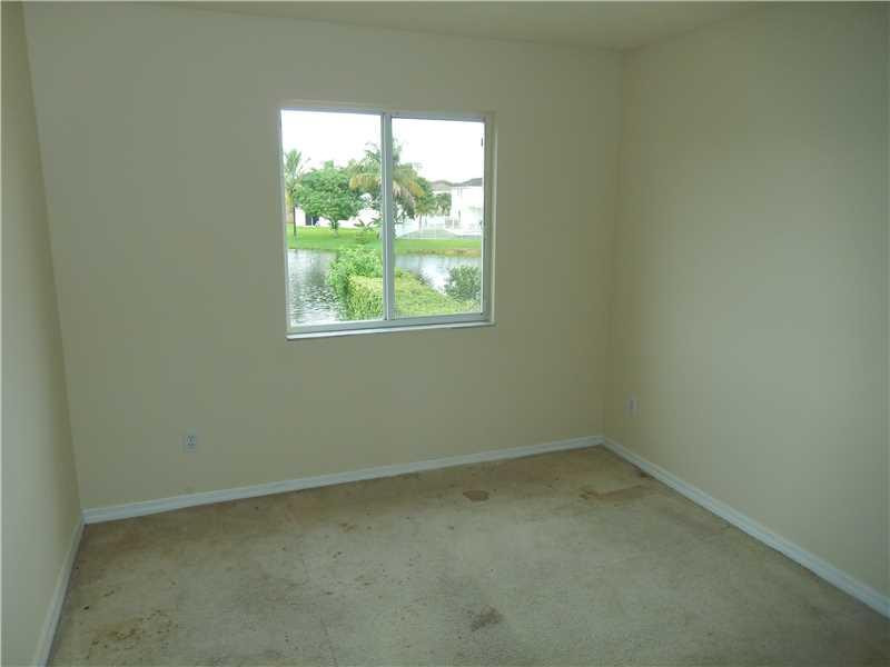 10323 Southwest 24th Street Miramar, FL 33025 - Photo 11 of 21 an empty room with a window