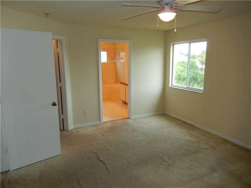 10323 Southwest 24th Street Miramar, FL 33025 - Photo 13 of 21 an empty room with windows and closet