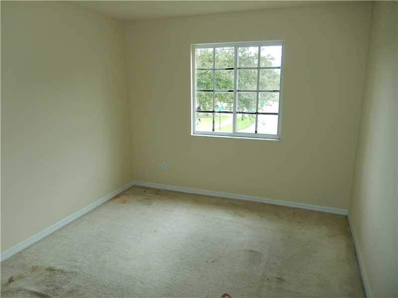 10323 Southwest 24th Street Miramar, FL 33025 - Photo 16 of 21 an empty room with a window
