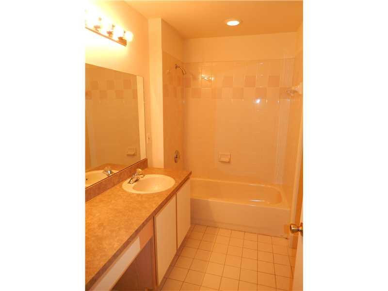 10323 Southwest 24th Street Miramar, FL 33025 - Photo 18 of 21 a bathroom with a sink and a mirror