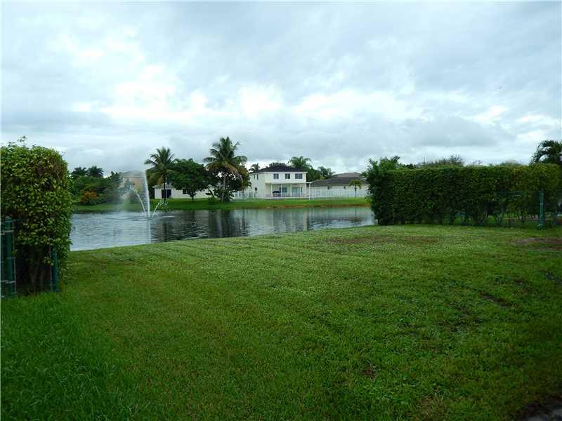 10323 Southwest 24th Street Miramar, FL 33025 - Photo 19 of 21 a view of a lake with a big yard
