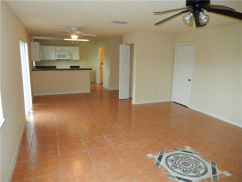 10323 Southwest 24th Street Miramar, FL 33025 - Photo 2 of 21 a view of a kitchen with a sink and cabinets