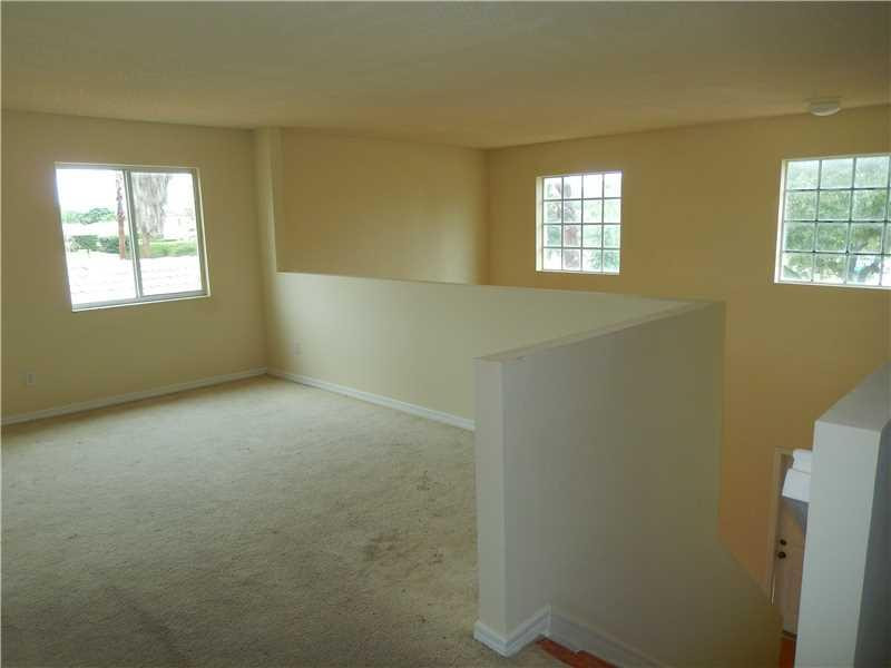 10323 Southwest 24th Street Miramar, FL 33025 - Photo 9 of 21 a view of an empty room with a window