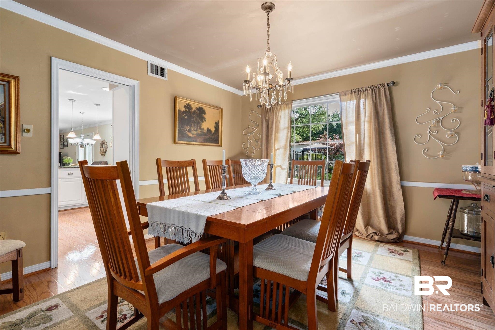 559 East Cumberland Road Mobile, AL 36608 - Photo 5 of 48 Dining room featuring suspended lighting, light wood-type flooring, and ornamental molding