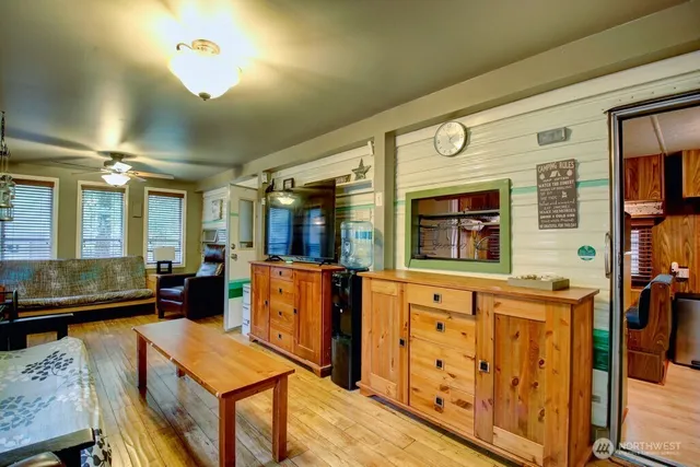 a dining hall with stainless steel appliances granite countertop a stove and a refrigerator